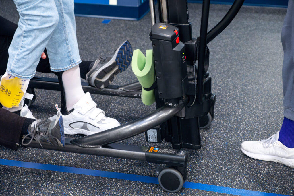 feet walking with the help of the rifton gait trainer